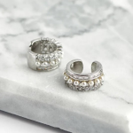 Rhodium-plated sterling silver double-tiered ear cuffs featuring a top row of square-cut crystals and a bottom row of small, spherical white pearls