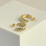 18k gold-tone medium-sized C-hoop earrings featuring a thick, rounded dome silhouette with a classic diagonal ribbed "croissant" texture