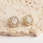 18k gold-tone square-shaped stud earrings featuring a central cluster of three rectangular baguette-cut crystals surrounded by a shimmering pavé halo