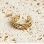 18k gold-tone ear cuff featuring delicate milgrain beaded edges and a central row of shimmering round solitaire crystals