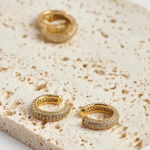 18k gold-tone wide ear cuffs encrusted with three dense rows of shimmering micro-pavé crystals for a full-coverage sparkle
