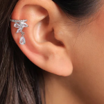Rhodium-plated ear cuff featuring a pavé band with a cascading botanical cluster of marquise-cut crystals and a dangling pear-cut teardrop