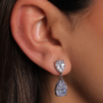 Sophisticated silver-tone drop earrings featuring two luminous, faceted pear-cut crystals in a classic, refined silhouette
