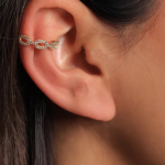 A structural, modern ear cuff featuring an elongated, polished metal bar centered with a delicate pavé-encrusted link