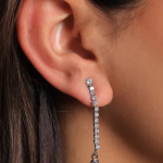 Elegant silver-tone drop earrings featuring a long, vertical line of pavé-set crystals that cascades gracefully from the earlobe