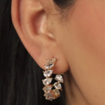 18k gold-tone hoop earrings featuring a continuous row of shimmering pear-cut crystals in a prong setting.